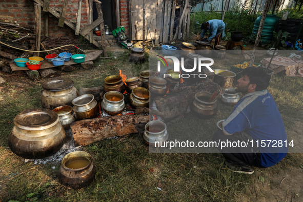 Traditional Kashmiri chefs cut lamb meat to prepare wazwan dishes in Sopore, Jammu and Kashmir, India, on September 14, 2024. Wazwan is a tr...