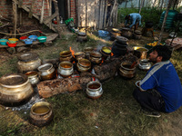 Traditional Kashmiri chefs cut lamb meat to prepare wazwan dishes in Sopore, Jammu and Kashmir, India, on September 14, 2024. Wazwan is a tr...