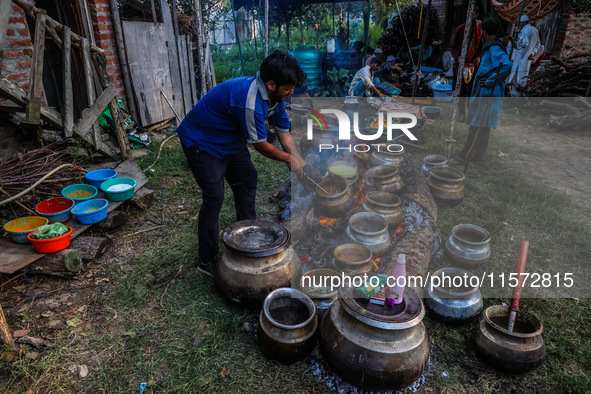 Traditional Kashmiri chefs cut lamb meat to prepare wazwan dishes in Sopore, Jammu and Kashmir, India, on September 14, 2024. Wazwan is a tr...