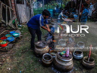 Traditional Kashmiri chefs cut lamb meat to prepare wazwan dishes in Sopore, Jammu and Kashmir, India, on September 14, 2024. Wazwan is a tr...