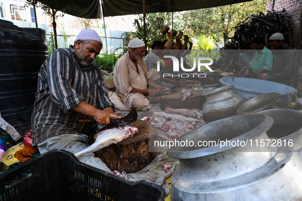 Traditional Kashmiri chefs cut lamb meat to prepare wazwan dishes in Sopore, Jammu and Kashmir, India, on September 14, 2024. Wazwan is a tr...