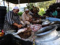 Traditional Kashmiri chefs cut lamb meat to prepare wazwan dishes in Sopore, Jammu and Kashmir, India, on September 14, 2024. Wazwan is a tr...