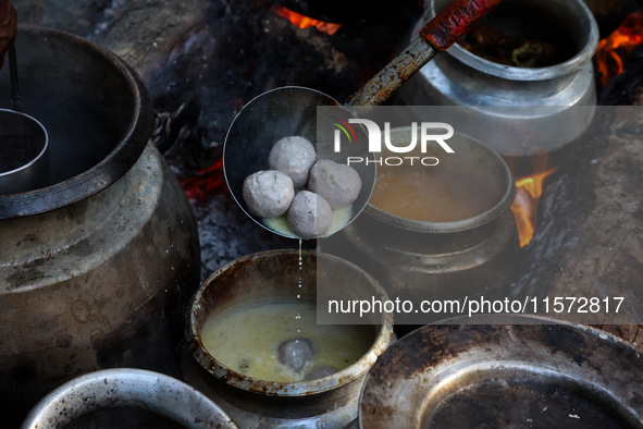 Traditional Kashmiri chefs cut lamb meat to prepare wazwan dishes in Sopore, Jammu and Kashmir, India, on September 14, 2024. Wazwan is a tr...