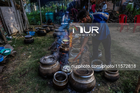 Traditional Kashmiri chefs cut lamb meat to prepare wazwan dishes in Sopore, Jammu and Kashmir, India, on September 14, 2024. Wazwan is a tr...