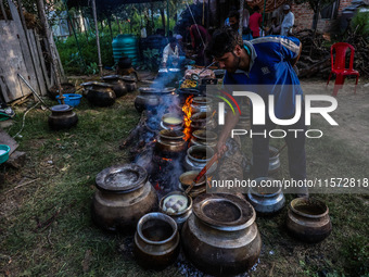 Traditional Kashmiri chefs cut lamb meat to prepare wazwan dishes in Sopore, Jammu and Kashmir, India, on September 14, 2024. Wazwan is a tr...