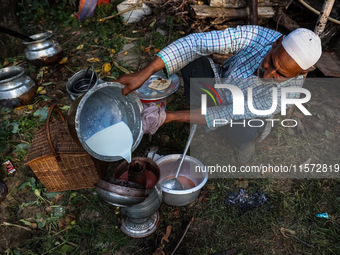 A chef prepares Kashmiri Salt Tea (Nun Chai) at a wedding function in Sopore, Jammu and Kashmir, India, on September 14, 2024. (