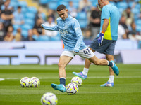 Phil Foden #47 of Manchester City F.C. during the Premier League match between Manchester City and Brentford at the Etihad Stadium in Manche...