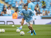 Phil Foden #47 of Manchester City F.C. during the Premier League match between Manchester City and Brentford at the Etihad Stadium in Manche...