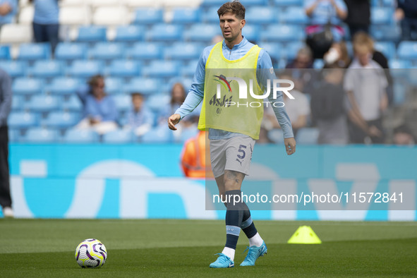 John Stones #5 of Manchester City F.C. during the Premier League match between Manchester City and Brentford at the Etihad Stadium in Manche...