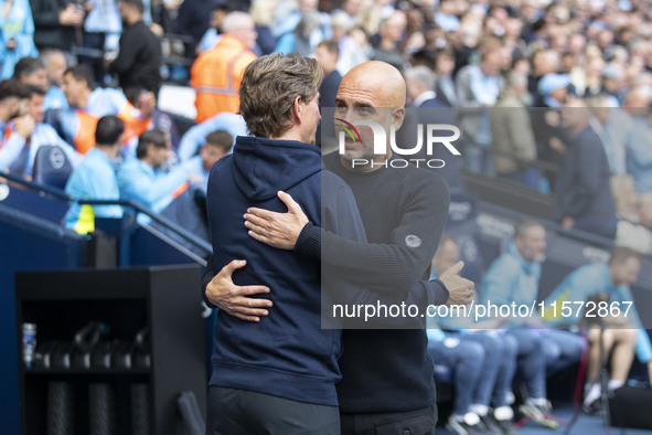 Manchester City F.C. manager Pep Guardiola and Brentford manager shake hands during the Premier League match between Manchester City and Bre...