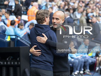 Manchester City F.C. manager Pep Guardiola and Brentford manager shake hands during the Premier League match between Manchester City and Bre...