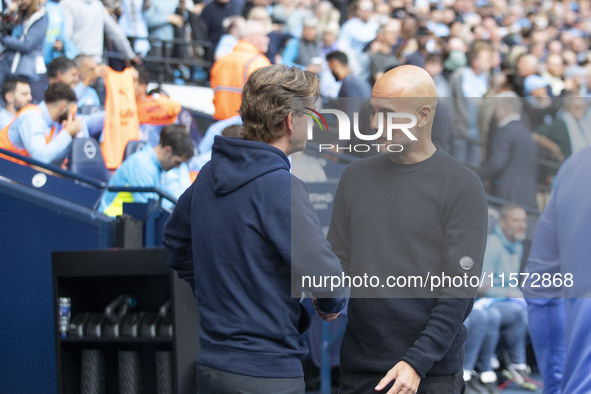 Manchester City F.C. manager Pep Guardiola and Brentford manager shake hands during the Premier League match between Manchester City and Bre...