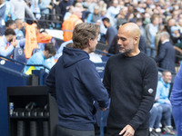 Manchester City F.C. manager Pep Guardiola and Brentford manager shake hands during the Premier League match between Manchester City and Bre...