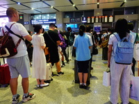 A large number of passengers prepare to travel at Yichang East Railway Station during the Mid-Autumn Festival holiday in Yichang, China, on...