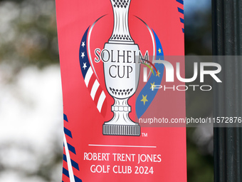 GAINESVILLE, VIRGINIA - SEPTEMBER 14: A banner is displayed on a lightpost with the Solheim Cup logo during Day Two of the Solheim Cup at Ro...