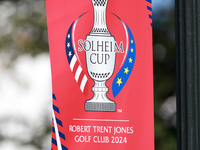 GAINESVILLE, VIRGINIA - SEPTEMBER 14: A banner is displayed on a lightpost with the Solheim Cup logo during Day Two of the Solheim Cup at Ro...