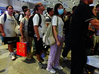 A large number of passengers prepare to travel at Yichang East Railway Station during the Mid-Autumn Festival holiday in Yichang, China, on...