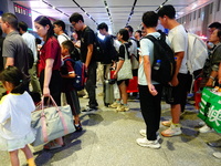 A large number of passengers prepare to travel at Yichang East Railway Station during the Mid-Autumn Festival holiday in Yichang, China, on...