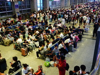 A large number of passengers prepare to travel at Yichang East Railway Station during the Mid-Autumn Festival holiday in Yichang, China, on...