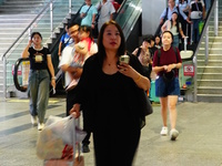 A large number of passengers prepare to travel at Yichang East Railway Station during the Mid-Autumn Festival holiday in Yichang, China, on...