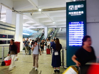 A large number of passengers prepare to travel at Yichang East Railway Station during the Mid-Autumn Festival holiday in Yichang, China, on...