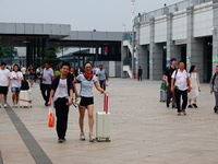 A large number of passengers prepare to travel at Yichang East Railway Station during the Mid-Autumn Festival holiday in Yichang, China, on...