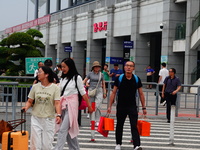 A large number of passengers prepare to travel at Yichang East Railway Station during the Mid-Autumn Festival holiday in Yichang, China, on...