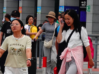 A large number of passengers prepare to travel at Yichang East Railway Station during the Mid-Autumn Festival holiday in Yichang, China, on...