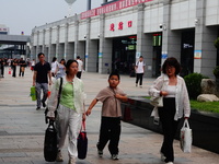 A large number of passengers prepare to travel at Yichang East Railway Station during the Mid-Autumn Festival holiday in Yichang, China, on...