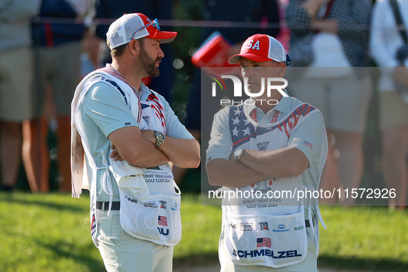 GAINESVILLE, VIRGINIA - SEPTEMBER 14: The caddies for Sarah Schmelzel of the United States (R) and Lilia Vu of of Team USA (L) wait on the 7...