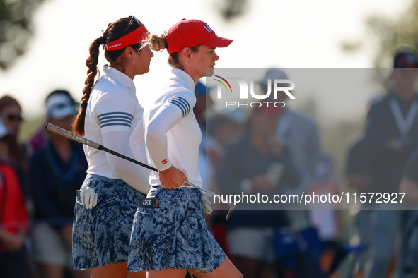 GAINESVILLE, VIRGINIA - SEPTEMBER 14: Sarah Schmelzel of the United States (R, foreground) and Lilia Vu of of Team USA (L, background) wait...