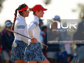 GAINESVILLE, VIRGINIA - SEPTEMBER 14: Sarah Schmelzel of the United States (R, foreground) and Lilia Vu of of Team USA (L, background) wait...