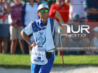 GAINESVILLE, VIRGINIA - SEPTEMBER 14: The caddie for Celine Boutier of Team Europe waits on the 7th green during Day Two of the Solheim Cup...