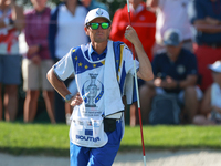 GAINESVILLE, VIRGINIA - SEPTEMBER 14: The caddie for Celine Boutier of Team Europe waits on the 7th green during Day Two of the Solheim Cup...