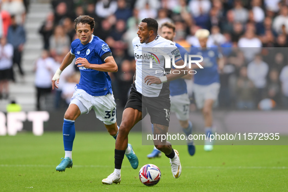 Nathaniel Mendez-Laing of Derby County is under pressure from Perry Ng of Cardiff City during the Sky Bet Championship match between Derby C...