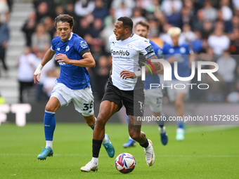 Nathaniel Mendez-Laing of Derby County is under pressure from Perry Ng of Cardiff City during the Sky Bet Championship match between Derby C...