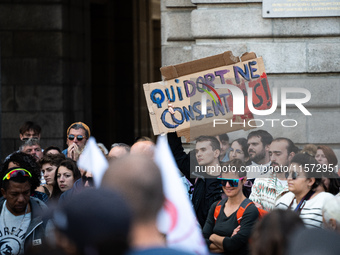 A protestor holds a placard reading ''who sleeps does not consent'' during a demonstration in support of Gisele Pelicot in Rennes, France, o...