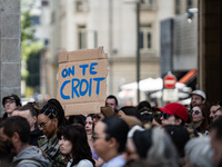 A protestor holds a placard reading ''we believe you'' during a demonstration in support of Gisele Pelicot in Rennes, France, on September 1...