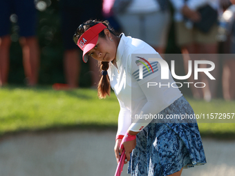 GAINESVILLE, VIRGINIA - SEPTEMBER 14: Lilia Vu of of Team USA prepares to putt on the 7th green during Day Two of the Solheim Cup at Robert...