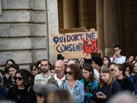 A protestor holds a placard reading ''who sleeps does not consent'' during a demonstration in support of Gisele Pelicot in Rennes, France, o...