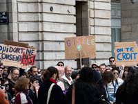 Three protestors hold placards reading ''who sleeps does not consent,'' ''Gisele I love you,'' and ''we believe you'' during a demonstration...