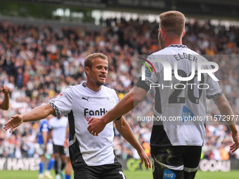 Kenzo Goudmijn of Derby County celebrates with Callum Elder of Derby County after scoring a goal to make it 1-0 during the Sky Bet Champions...