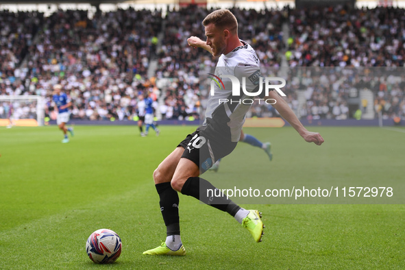 Callum Elder of Derby County crosses the ball, leading to his side's first goal during the Sky Bet Championship match between Derby County a...