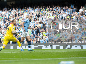 Erling Haaland #9 of Manchester City F.C. scores a goal during the Premier League match between Manchester City and Brentford at the Etihad...