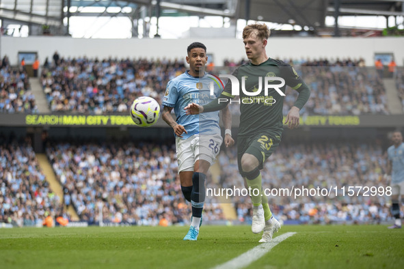 Keane Lewis-Potter #23 of Brentford F.C. in action during the Premier League match between Manchester City and Brentford at the Etihad Stadi...