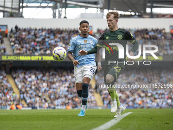 Keane Lewis-Potter #23 of Brentford F.C. in action during the Premier League match between Manchester City and Brentford at the Etihad Stadi...