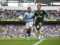 Keane Lewis-Potter #23 of Brentford F.C. in action during the Premier League match between Manchester City and Brentford at the Etihad Stadi...