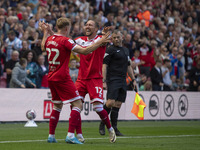 Luke Ayling of Middlesbrough celebrates with goalscorer Tommy Conway of Middlesbrough during the Sky Bet Championship match between Middlesb...