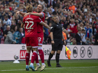 Luke Ayling of Middlesbrough celebrates with goalscorer Tommy Conway of Middlesbrough during the Sky Bet Championship match between Middlesb...