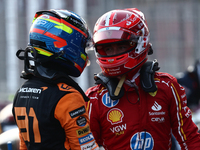 Oscar Piastri of McLaren and Charles Leclerc of Ferrari after qualifying ahead of the Formula 1 Grand Prix of Azerbaijan at Baku City Circui...